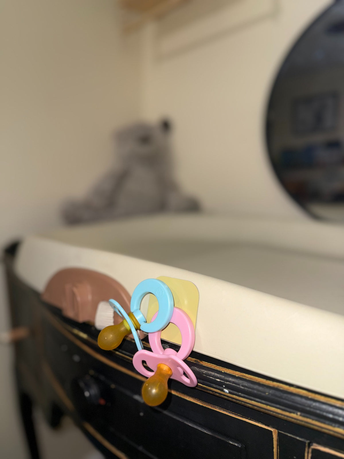 Sky and Blush Magnetot pacifiers kept visible in a bedroom routine